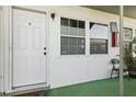 Charming entrance featuring a well-lit porch with decorative accents and white paneled door at 840 Center Ave # 9, Daytona Beach, FL 32117