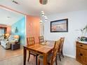 Cozy dining room featuring wooden table set and stylish pendant lighting at 907 Rose Ln, The Villages, FL 32159