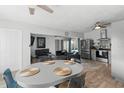 Bright living space with ceiling fans, an open floor plan, and wood-look tile flooring at 1268 Bel Aire Dr, Daytona Beach, FL 32118