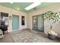 Inviting foyer features tile flooring, unique ceiling detail and dual entry points, offering a bright, welcoming space at 1924 Seclusion Dr, Port Orange, FL 32128