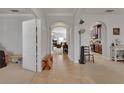 Arched hallway view through into living room and kitchen at 205 Victoria Trails Blvd, Deland, FL 32724