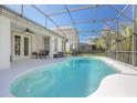 Beautiful backyard pool area featuring screened enclosure and ample patio space at 215 Coleton Ln, Deland, FL 32724