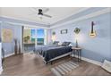 Sunlit main bedroom featuring a calming color scheme, balcony access, and scenic views of the ocean at 2403 S Atlantic Ave # 209, Daytona Beach Shores, FL 32118