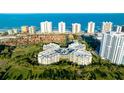 Aerial view of a condo building with ocean in background at 3 Oceans West Blvd # 1D6, Daytona Beach Shores, FL 32118