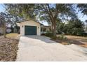 Charming one-story home with a convenient one-car garage, mature trees, and a spacious driveway at 370 Charles Ave, Orange City, FL 32763