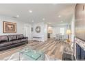 Open-concept living area with hardwood floors, seamlessly connected to the dining area at 408 Wisteria Rd, Daytona Beach, FL 32118