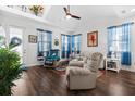 Comfortable living room with hardwood floors, ample natural light, and stylish decor at 562 Landshark Blvd, Daytona Beach, FL 32124
