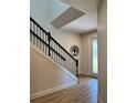 Beautiful staircase with dark wooden rails and white walls, showcasing modern design at 7024 Lanier Falls Rd, Deland, FL 32724
