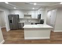 Bright kitchen with stainless steel appliances and a center island at 266 N High St, Lake Helen, FL 32744
