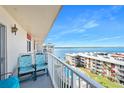 Balcony with seating overlooking the water, perfect for relaxing and enjoying the scenery at 2711 N Halifax Ave # 890, Daytona Beach, FL 32118