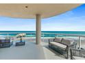 Spacious balcony with furniture overlooking beautiful ocean and pier at 3703 S Atlantic Ave # 507, Daytona Beach Shores, FL 32118