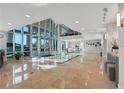 Spacious lobby with soaring ceilings and large windows at 3703 S Atlantic Ave # 507, Daytona Beach Shores, FL 32118