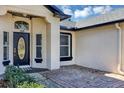 Close up of the front entrance featuring the house number above the decorative glass front door at 509 Kettering Rd, Deltona, FL 32725