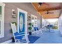Relaxing front porch with rocking chairs and a hammock at 5306 Empire Church Rd, Groveland, FL 34736