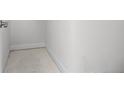 Unfinished storage with concrete floor and white walls at 559 Coronado Cove Rd, New Smyrna Beach, FL 32168