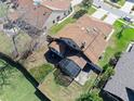 Aerial view of a home with a screened in patio and a fenced in backyard at 6157 Sequoia Dr, Port Orange, FL 32127