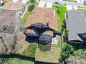 Aerial view of a home with a screened in patio and a fenced in backyard at 6157 Sequoia Dr, Port Orange, FL 32127