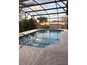 Inviting screened-in pool with clear water, perfect for relaxing and entertaining outdoors at 1420 Felton St, Deltona, FL 32725