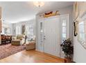 Bright and airy foyer with hardwood floors, plantation shutters, and elegant decor at 1552 Covered Bridge Dr, Deland, FL 32724