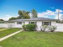 Charming one-story home featuring a well-manicured lawn and an attached one car garage at 1579 Brady Dr, Deltona, FL 32725