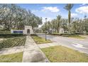 Scenic entrance to LPGA International community with manicured landscaping at 232 Gala Cir, Daytona Beach, FL 32124