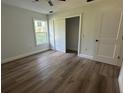 Bedroom featuring wood floors, a closet and a window providing plenty of natural light at 283 Wildwood Dr, New Smyrna Beach, FL 32168