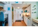 Cozy kitchenette with white cabinets, stylish decor, and modern convenience at 313 S Atlantic Ave # 6140, Daytona Beach, FL 32118
