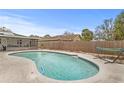 Backyard pool with a serene setting featuring a hammock, perfect for enjoying sunny days at 445 Virginia Ave, St Cloud, FL 34769