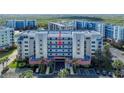 Exterior view of a condo building featuring multiple stories and well maintained landscaping at 5300 S Atlantic Ave # 8-404, New Smyrna Beach, FL 32169
