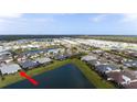 Extensive aerial view of the residential area, community ponds, and neighboring properties at 583 Lost Shaker Way, Daytona Beach, FL 32124