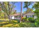 Lovely single-story home with neat landscaping, shutters, and a well-maintained lawn at 741 Greenway Pl, Daytona Beach, FL 32114