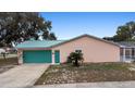This home features an attached garage, a quaint backyard, and convenient access at 980 Buttercup Ter, Deltona, FL 32725