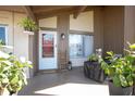 Well-decorated front porch with seating, potted plants, and a decorative ladder near the front door at 10477 Montpelier Cir, Orlando, FL 32821