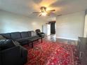 Comfortable living room with a ceiling fan and a large area rug at 1341 Imperial Dr, Daytona Beach, FL 32117
