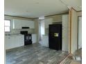 Bright kitchen with modern black appliances, white cabinets, and stylish flooring at 1367 Vine St, Daytona Beach, FL 32117