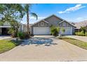 Charming townhome featuring a two-car garage, and mature landscaping at 2015 Cornell Pl, Port Orange, FL 32128