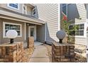 A quaint front entrance of a townhome with brick accents and a small garden at 2015 Cornell Pl, Port Orange, FL 32128
