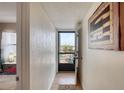 Inviting entryway featuring wood floors and a view of the balcony's outdoor scenery at 2700 Ocean Shore Blvd # 305, Ormond Beach, FL 32176