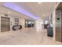 Elegant lobby featuring marble floors, stylish seating, and convenient elevator access at 2967 S Atlantic Ave # 604, Daytona Beach, FL 32118