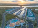 High angle view showcases waterfront condos, boat slips, pool, and clubhouse at 4626 Harbour Village Blvd # 3302, Ponce Inlet, FL 32127