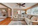 Cozy living room with a large sectional sofa, and a view into the dining room and front door at 72 Rockefeller Dr, Ormond Beach, FL 32176