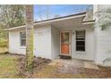 Close-up of the front door, showing the house number at 749 Cassadaga Rd, Lake Helen, FL 32744