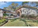 Beautiful home featuring a brick archway entrance and landscaped front yard at 857 Westchester Dr, Deland, FL 32724