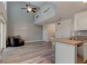 Bright open floor plan with lots of natural light with view of modern kitchen and living spaces at 1118 Meditation Loop, Port Orange, FL 32129
