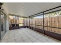 Enclosed patio with tile flooring and screens offering a relaxing outdoor space at 116 Moonstone Ct, Port Orange, FL 32129