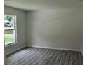 Bright bedroom featuring wood-look floors and a window for natural light at 1275 16Th St, Orange City, FL 32763
