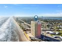 Sweeping aerial shot of a beachfront condo near the city skyline at 1900 N Atlantic Ave # 1603, Daytona Beach, FL 32118