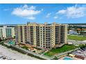 Beautiful beachfront condo with a pool, outdoor seating and lush green grass at 1925 S Atlantic Ave # 201, Daytona Beach, FL 32118