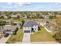 Aerial view of a home with spacious backyard and mature trees and landscaping at 1978 S Old Mill Dr, Deltona, FL 32725