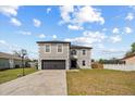 Charming two-story home with a well-manicured lawn and a basketball hoop at 1978 S Old Mill Dr, Deltona, FL 32725